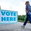 A person walks into the Beuhla Community Family Life Center in Dekalb County after the voting polls opens for the Georgia primary elections on Tuesday, May 21, 2024. (Miguel Martinez / AJC)