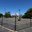 A fence is seen blocking access to the Gulch parking lot in Downtown Atlanta on Monday, July 1, 2024. Centennial Yards has begun construction on its central entertainment district, making parking unavailable on certain surface lots across much of the 50-acre property.
(Miguel Martinez / AJC)