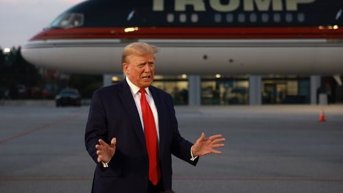 Former President Donald Trump speaks to the media at Atlanta Hartsfield-Jackson International Airport after surrendering at the Fulton County jail on Thursday, Aug. 24, 2023, in Atlanta. (Joe Raedle/Getty Images/TNS)