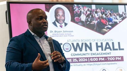 Bryan Johnson, the sole finalist for superintendent of Atlanta Public Schools, speaks to community members at The New Schools at Carver in Atlanta on Tuesday, June 25, 2024. (Seeger Gray / AJC)