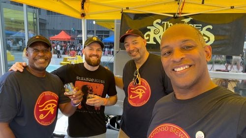 Kevin Downing of Khonso Brewing (from left) is seen with George Kepler of Strange Roots (a collaborating partner) and Corby Hannah and William Teasley of Khonso. (Courtesy of Khonso Brewing)