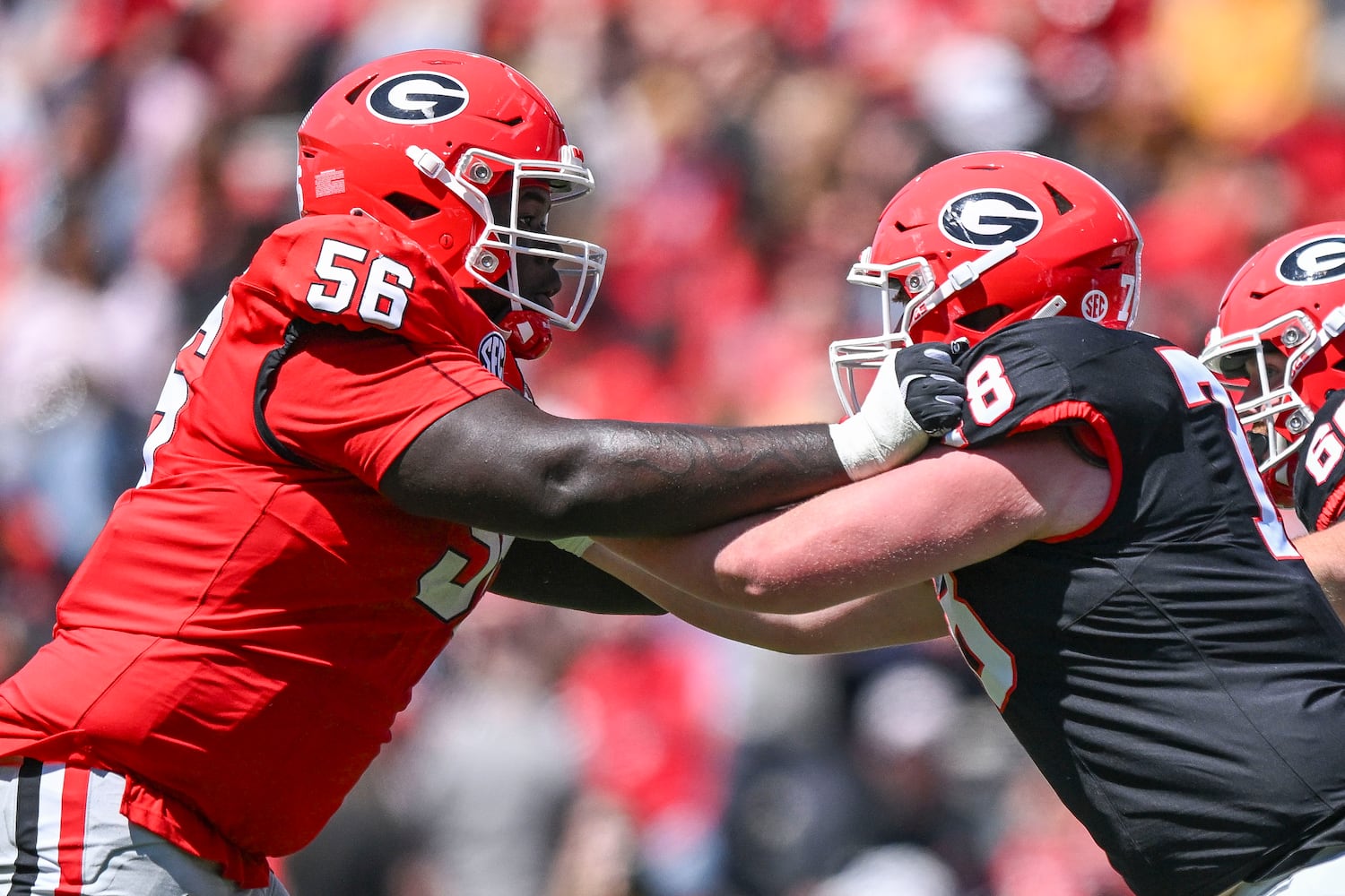 Georgia Red Team’s Micah Morris (56) squares off against Black Team’sTate Nelms (87) during the second half of the G-Day spring football game Saturday, April 12, 2025 at Sanford Stadium in Athens. (Daniel Varnado/For the Atlanta Journal-Constitution)