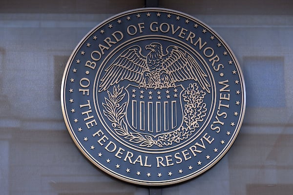 FILE - The seal of the Federal Reserve Board is seen at the Building in Washington, Saturday, Dec. 8, 2024. (AP Photo/Jose Luis Magana)