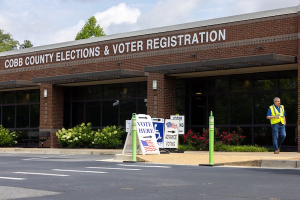 A poll worker exits the Cobb County Elections & Voter Registration building in Marietta on Tuesday, June 10, 2025, during early voting in the low-turnout Georgia Public Service Commission election. (Arvin Temkar / AJC)
