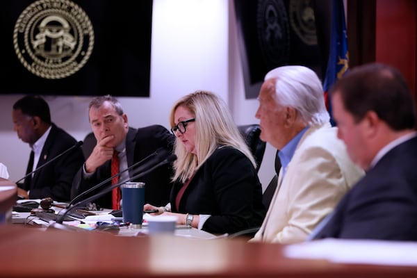 Public Service Commissioner Tricia Pridemore (center) directed a meeting where the board was expected to vote on a new Georgia Power rate increase that would raise the average customer's bill starting June 1.
Miguel Martinez /miguel.martinezjimenez@ajc.com