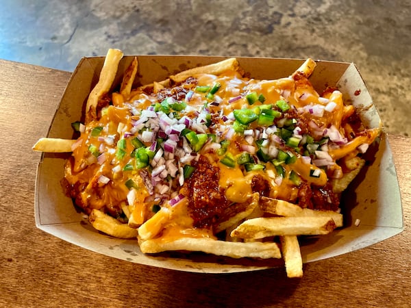 Southern poutine at Queenie’s BBQ in Woodstock. (Angela Hansberger for The Atlanta Journal-Constitution)