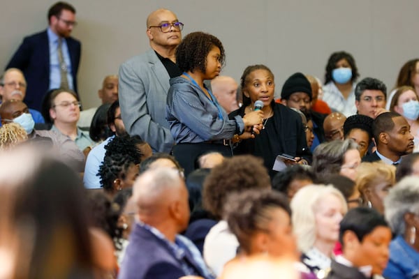 A member of the audience asks a question during a town hall meeting hosted by U.S. Sen. Raphael Warnock, D-Ga., at Zion Hill Baptist Church on May 4, 2025. (Miguel Martinez/AJC)