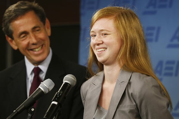 Abigail Fisher, who sued the University of Texas when she was not offered a spot at the university’s flagship Austin campus in 2008, with Edward Blum of the Project on Fair Representation, speaks at a news conference at the American Enterprise Institute in Washington, D.C. 