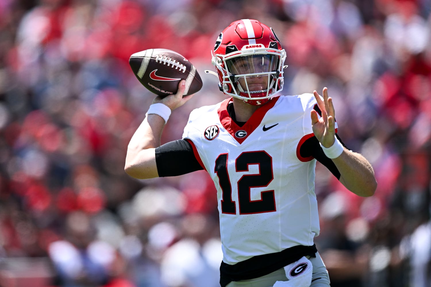 Georgia Black Team’s quarterback Ryan Puglisi (12) passes during the first half of the G-Day spring football game Saturday, April 12, 2025 at Sanford Stadium in Athens. (Daniel Varnado/For the Atlanta Journal-Constitution)