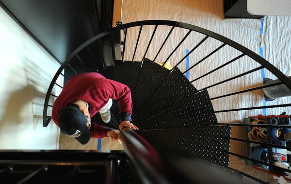 Mauro Rios at one of condo units at the Fulton Cotton Mill in Cabbagetown. HYOSUB SHIN / hshin@ajc.com