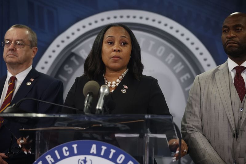 Atlanta DA Fani Willis answers questions for the press after the indictment of former President Trump and 18 others at Fulton County Courthouse on Monday, Aug. 14, 2023, in Atlanta. Special prosecutor Nathan Wade stands to her right. (Michael Blackshire/Atlanta Journal-Constitution/TNS)