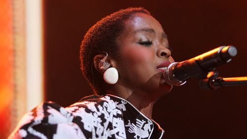 Lauryn Hill performs in September 2015 at One MusicFest at Aaron’s Amphitheater at Lakewood in Atlanta. She, along with the Fugees, will come to Atlanta on Aug. 16.  (Akili-Casundria Ramsess/Special to the AJC)