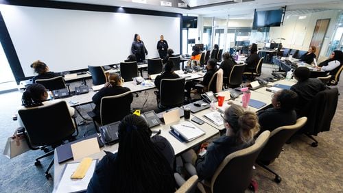 On Tuesday, April 2, 2024, supervisors address a group of trainees who will transition to the floor to answer 911 calls at the DeKalb County E-911 communications center. (Miguel Martinez /miguel.martinezjimenez@ajc.com)