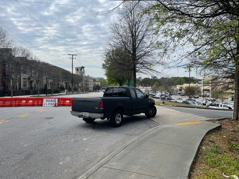 Vehicles trying to traverse Lavista Road, which is closed because of an apartment fire Nov. 10, must now drive through a shopping mall's parking lot or a nearby neighborhood.